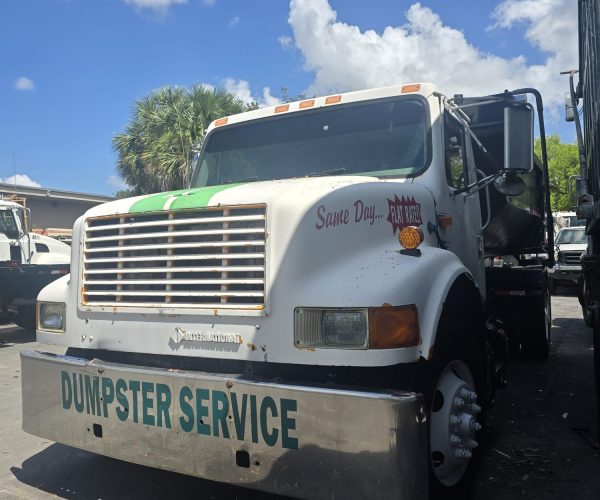 1998 INTERNATIONAL ROLL-OFF TRUCK WITH 12 FT BIN 002