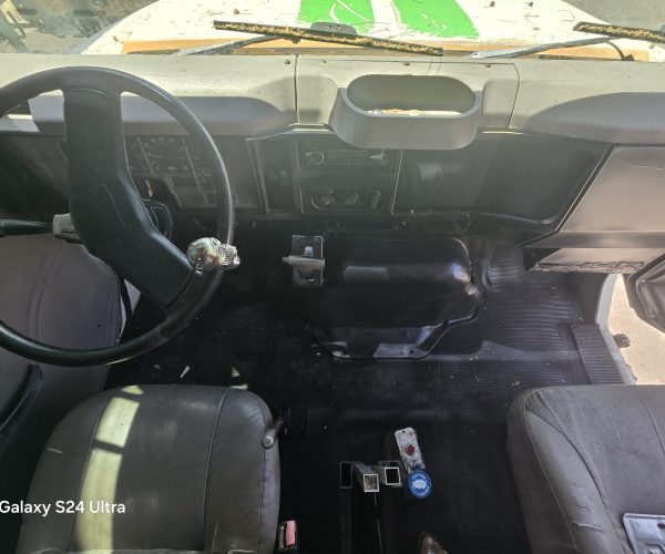 1998 INTERNATIONAL ROLL-OFF TRUCK WITH 12 FT BIN 012