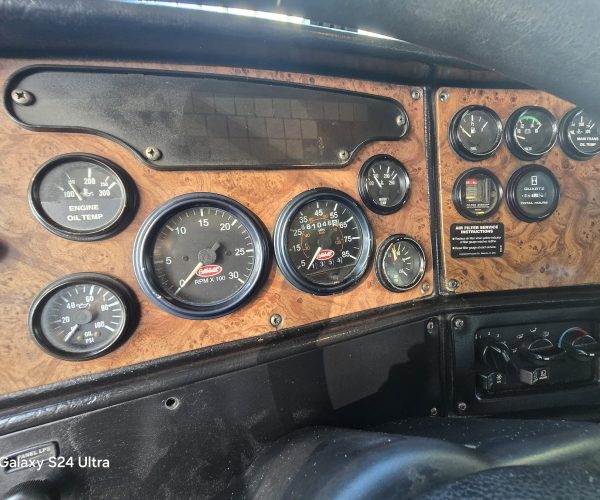 2005 PETERBILT 357 TRI AXLE DUMP TRUCK W STEERABLE THIRD AXLE FACTORY DOUBLE POWER STEERING 012